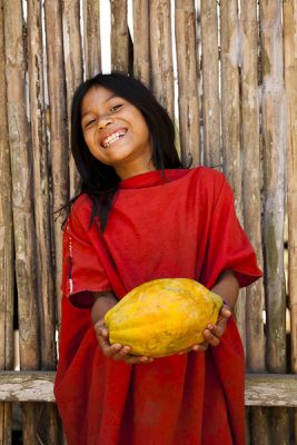 Ashaninka girl holding cocoa pod