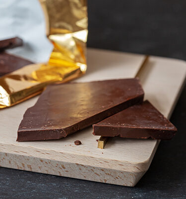 closeup of chocolate board with broken chocolate pieces
