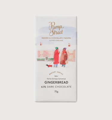 Picture of pump streets gingerbread bar on a grey background. The bar is white, with two people in red coats, and a sausage dog in a red coat, in watercolour