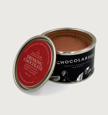 Picture of Chocolarder's drinking chocolate, in a black and red tin, on a grey background