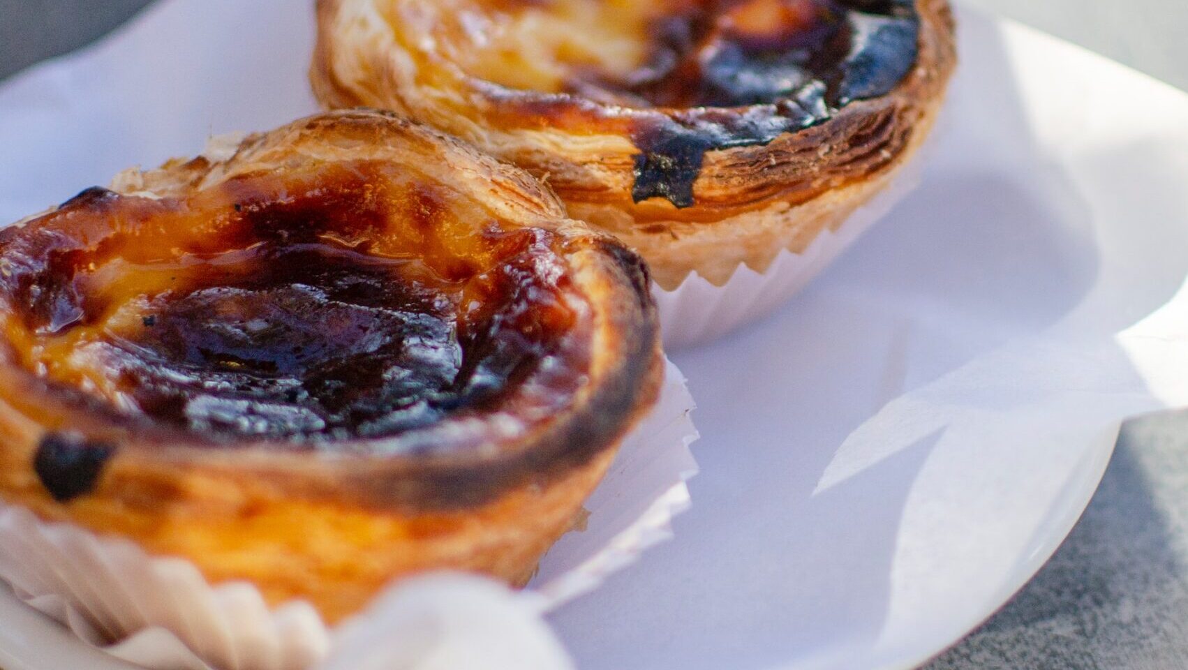 photo of pasteis de nata by Hector John Periquin