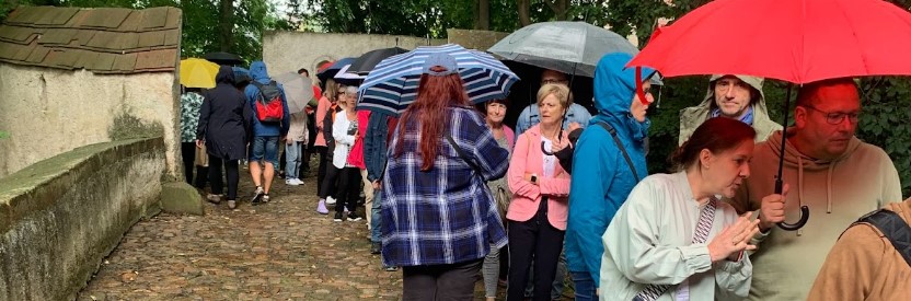 queuing for eurobean with umbrellas