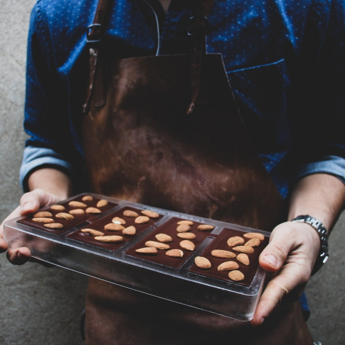 Mellow Chocolate bars with almonds in moulds