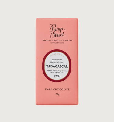 Picture of pump street madagascar bar, on a grey background. pink packaging with a red circle around the label