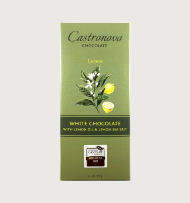 A white chocolate bar with lemon oil & sea salt from Castronovo. The packaging is green with a lemon tree on the front.