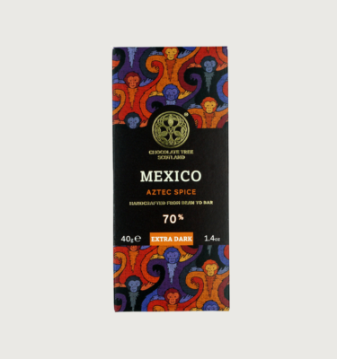 Picture of chocolate tree's 40g Aztec spice 85% dark bar. The packaging is orange, dark orange, navy, and light blue. The label in the centre of the bar is black.
