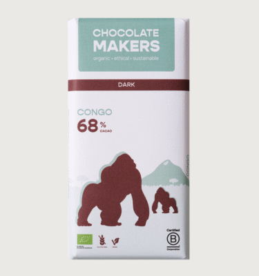 A bar from chocolatemakers on a grey background. the packaging is white, brown, and turquoise and features illustrations of two gorillas