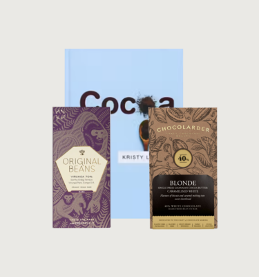 Picture of Dr Kristy Leissle's Cocoa box on a grey background. The book is a light blue colour, with 'Cocoa' in brown. There is a pile of cocoa powder replacing one of the 'o's in 'Cocoa'