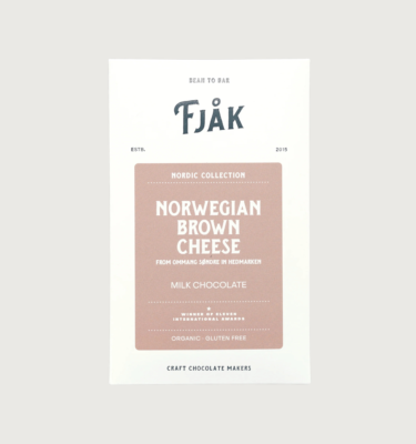 Picture of fjak's brown cheese bar on a grey background. The packaging is white with a light brown label in the middle.