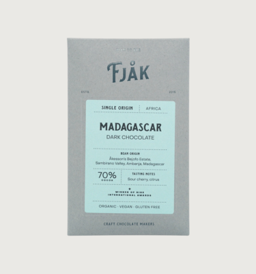 Picture of fjak's madagascar dark 70% bar on a grey background. The packaging is grey, with a light blue label in the centre.
