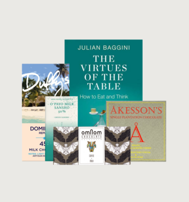 Picture of Julian Baggini's the virtues of the table book and bar gift on a grey background.