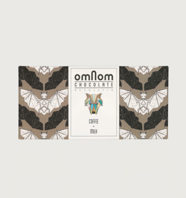 An omnom bar on a grey background. The packaging is black grey and white with bats