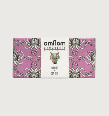 An omnom bar on a grey background. The packaging is pink and white with squids on it
