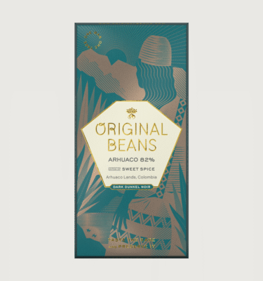 An original beans bar on a grey background. The packaging is green and gold.