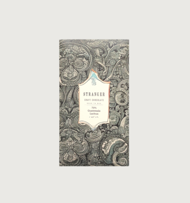 Stranger's guatemala 73% dark bar on a grey background. The bar is cream and black in colour, with the colours forming an intricate pattern. In the centre, the label is white, with black writing.