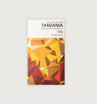 Svenska Kakaobolaget's Kokoa Kamili, Tanzania, Dark 74% chocolate bar. It's packaging is white at the top with geometric and almost 3D shapes down the bottom in yellows, oranges and reds.