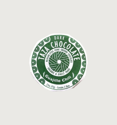Taza Chocolate's Mexican-style Guajillo Chili. It comes in a disc and its packaging is a deep green.